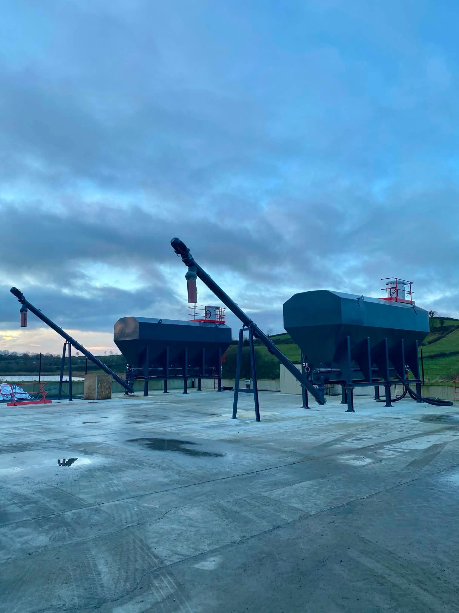 Two low-level silos installed with WAM screw conveyors